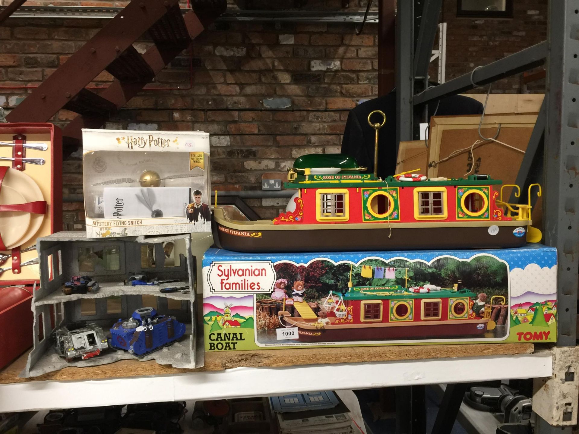 A SYLVANIAN FAMILIES CANAL BOAT IN BOX, AS NEW HARRY POTTER MYSTERY FLYING SNITCH AND A WARHAMMER