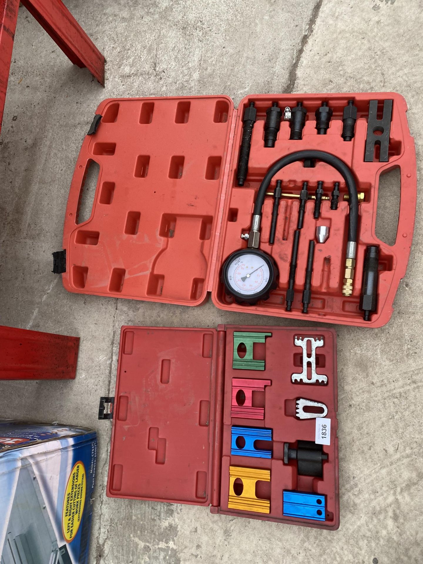 AN ASSORTMENT OF TOOLS TO INCLUDE A DISEL COMPRESSION GAUGE KIT ETC