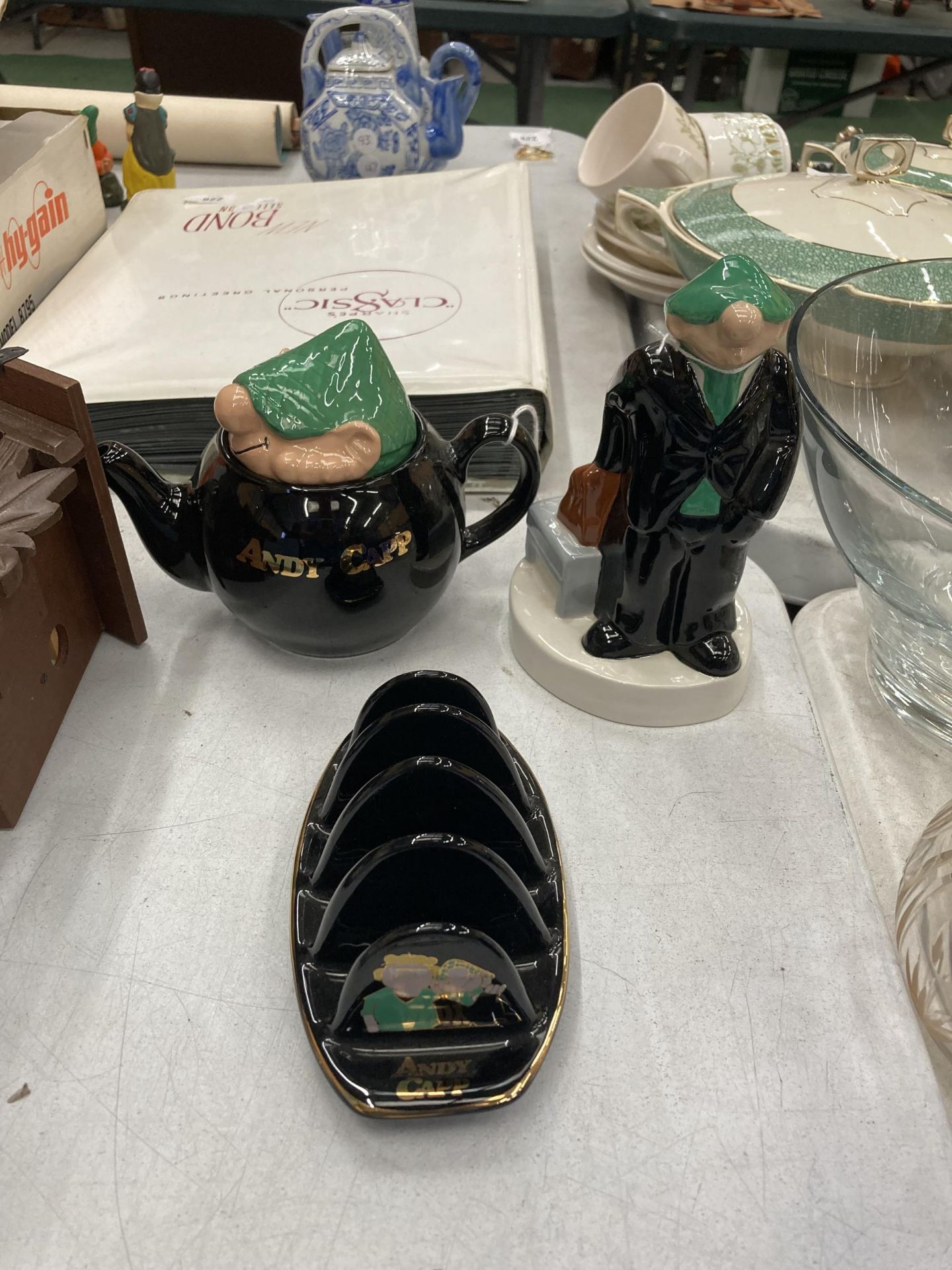 THREE PIECES OF WADE 'ANDY CAPP' TO INCLUDE A TEAPOT, TOAST RACK AND MONEY BOX