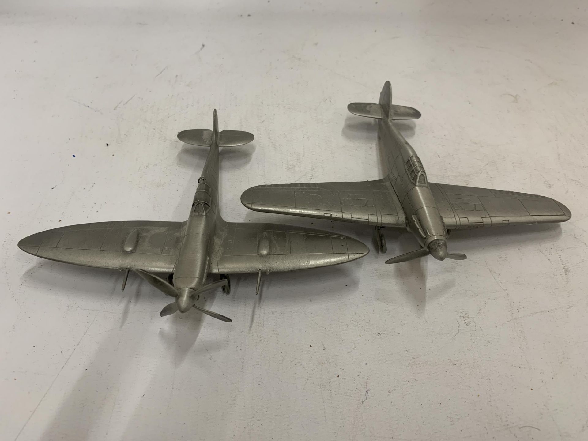 TWO PEWTER WORLD WAR 11 PLANES, A SPITFIRE AND HURRICANE