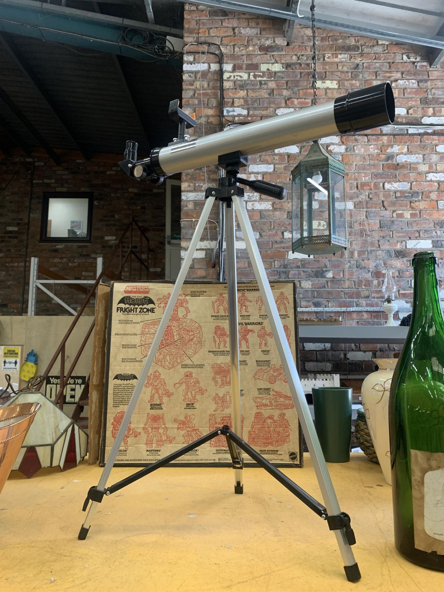 A TELESCOPE ON STRIPOD STAND