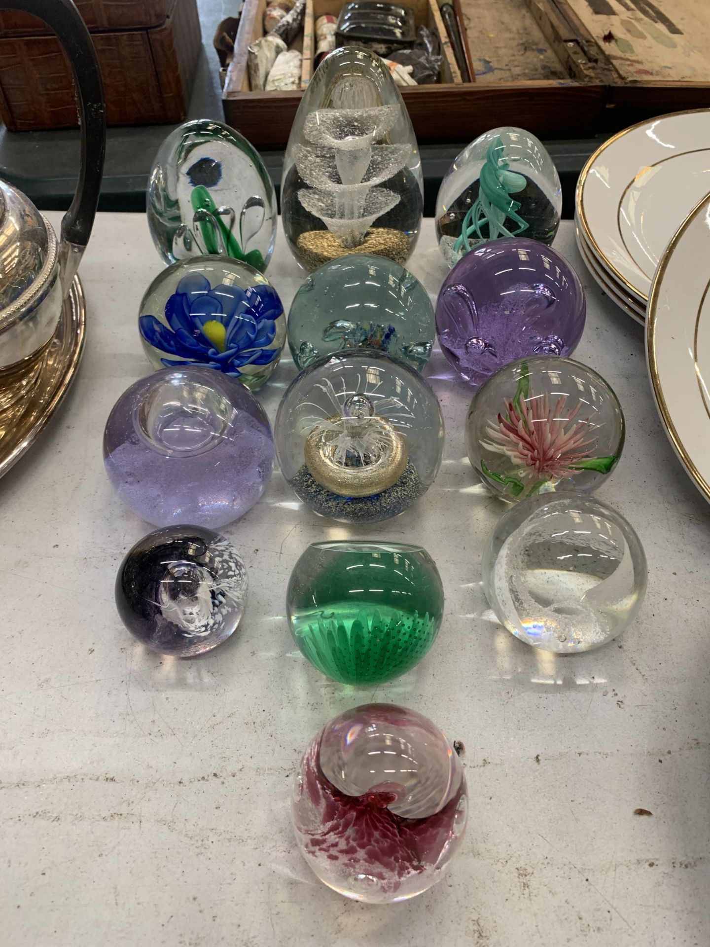 A GROUP OF ASSORTED ART GLASS PAPERWEIGHTS