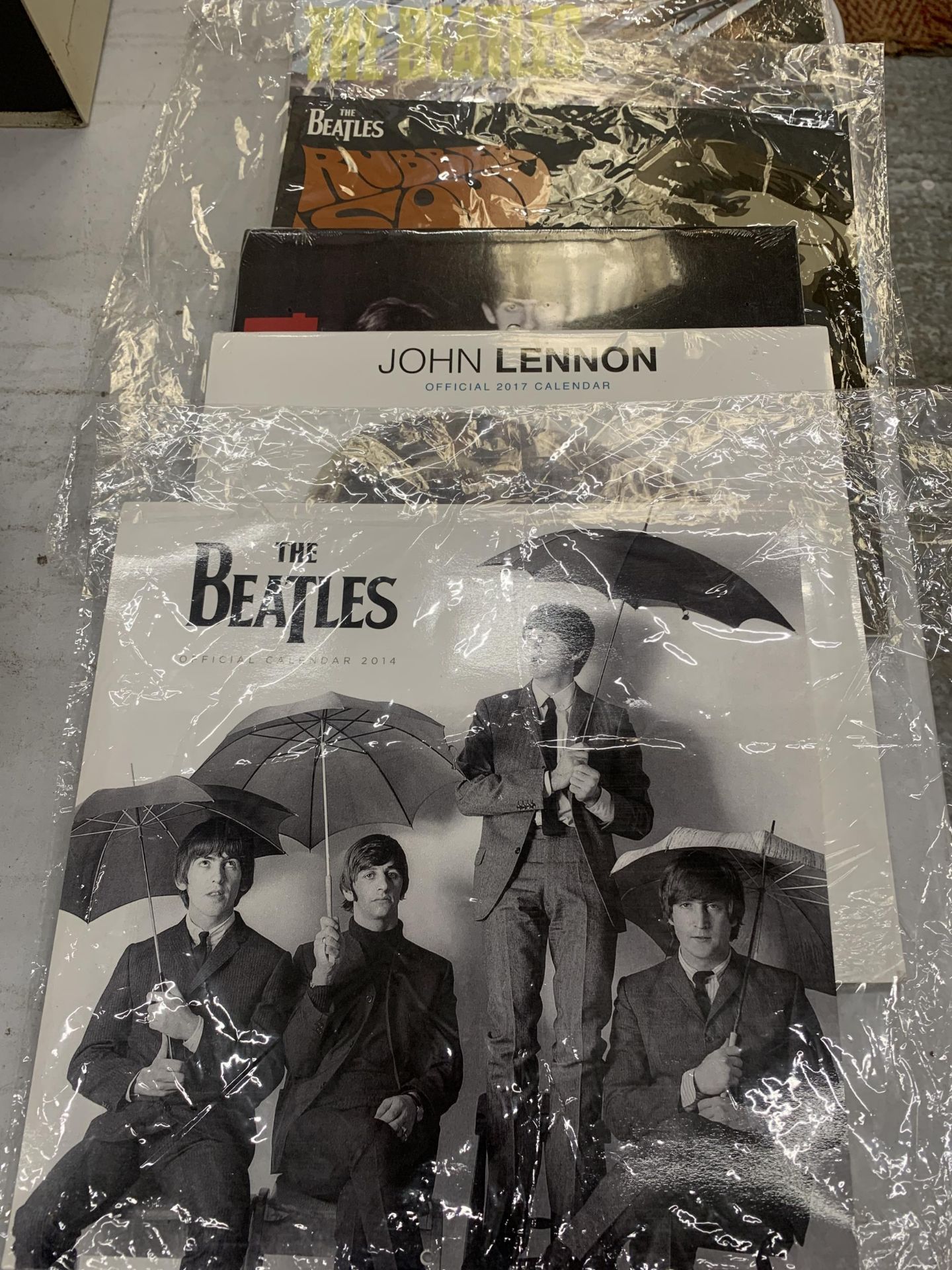 FOUR OFFICIAL NEW AND SEALED BEATLES CALENDARS, 2014 TO 2017
