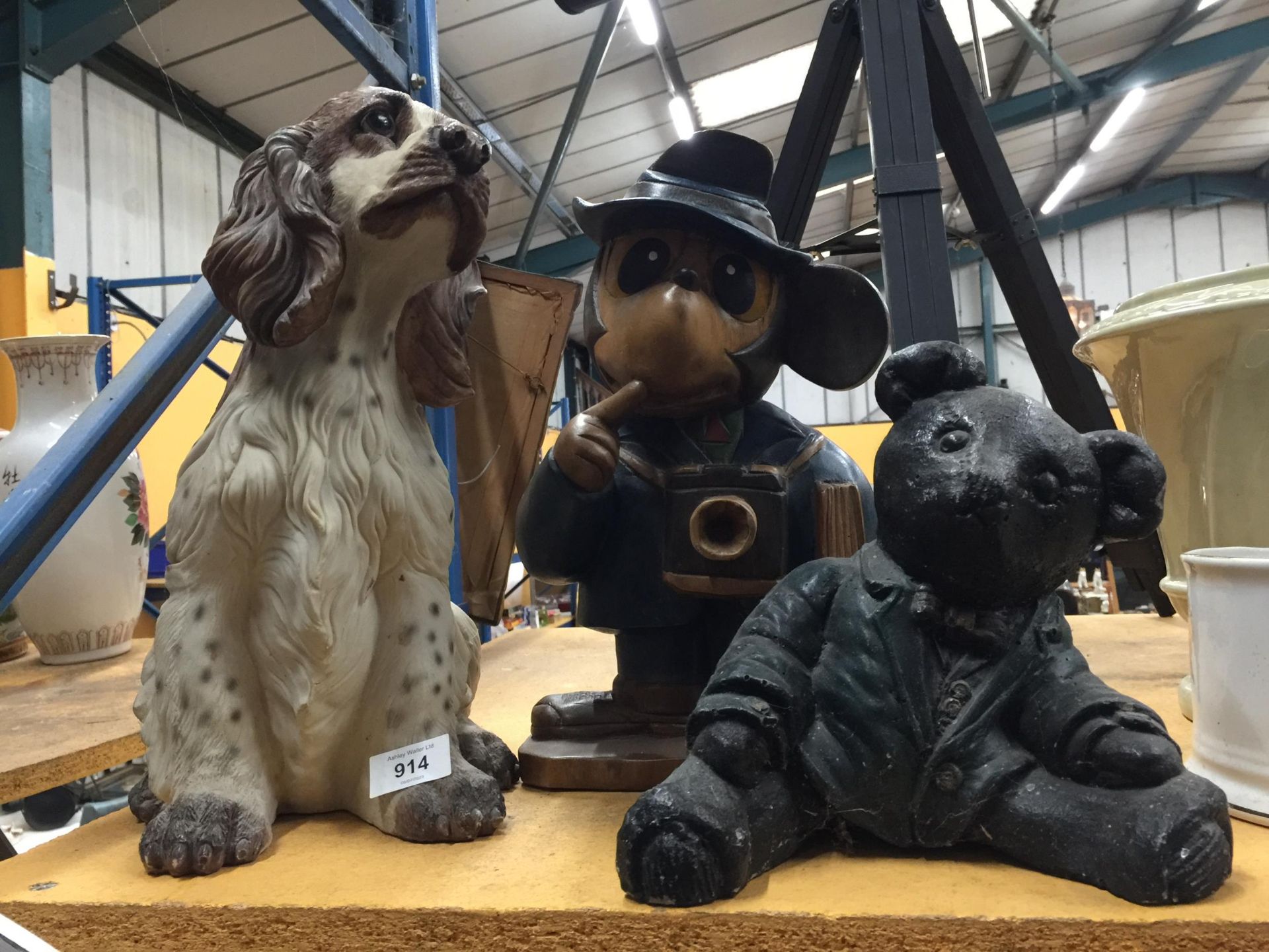 A LARGE RESIN SPANIEL, A WOODEN MICKEY MOUSE STYLE FIGURE AND A RESIN TEDDY