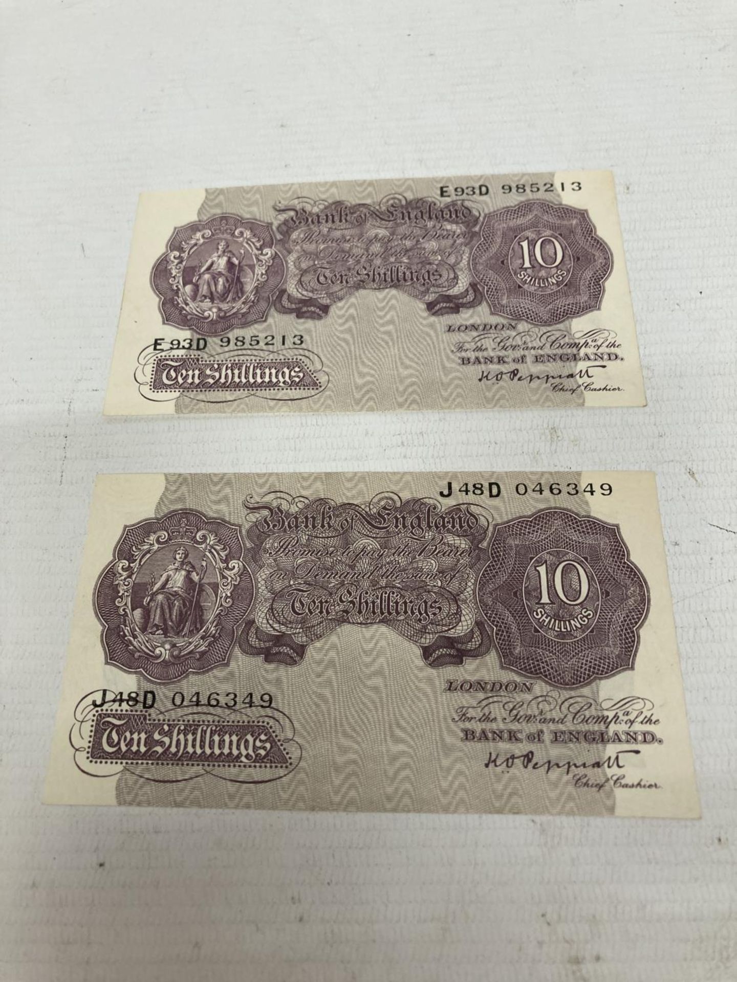 TWO BANK OF ENGLAND MAUVE TEN SHILLINGS NOTES SIGNED PEPPIATT (1934-1949)