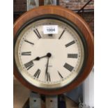 A WOODEN CASED WALL CLOCK