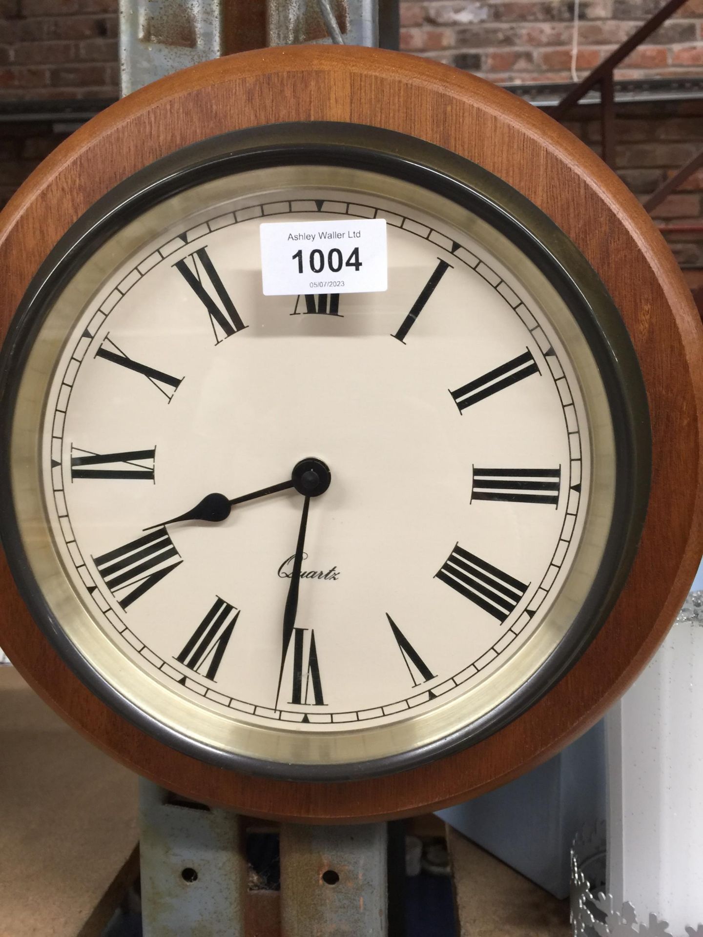 A WOODEN CASED WALL CLOCK