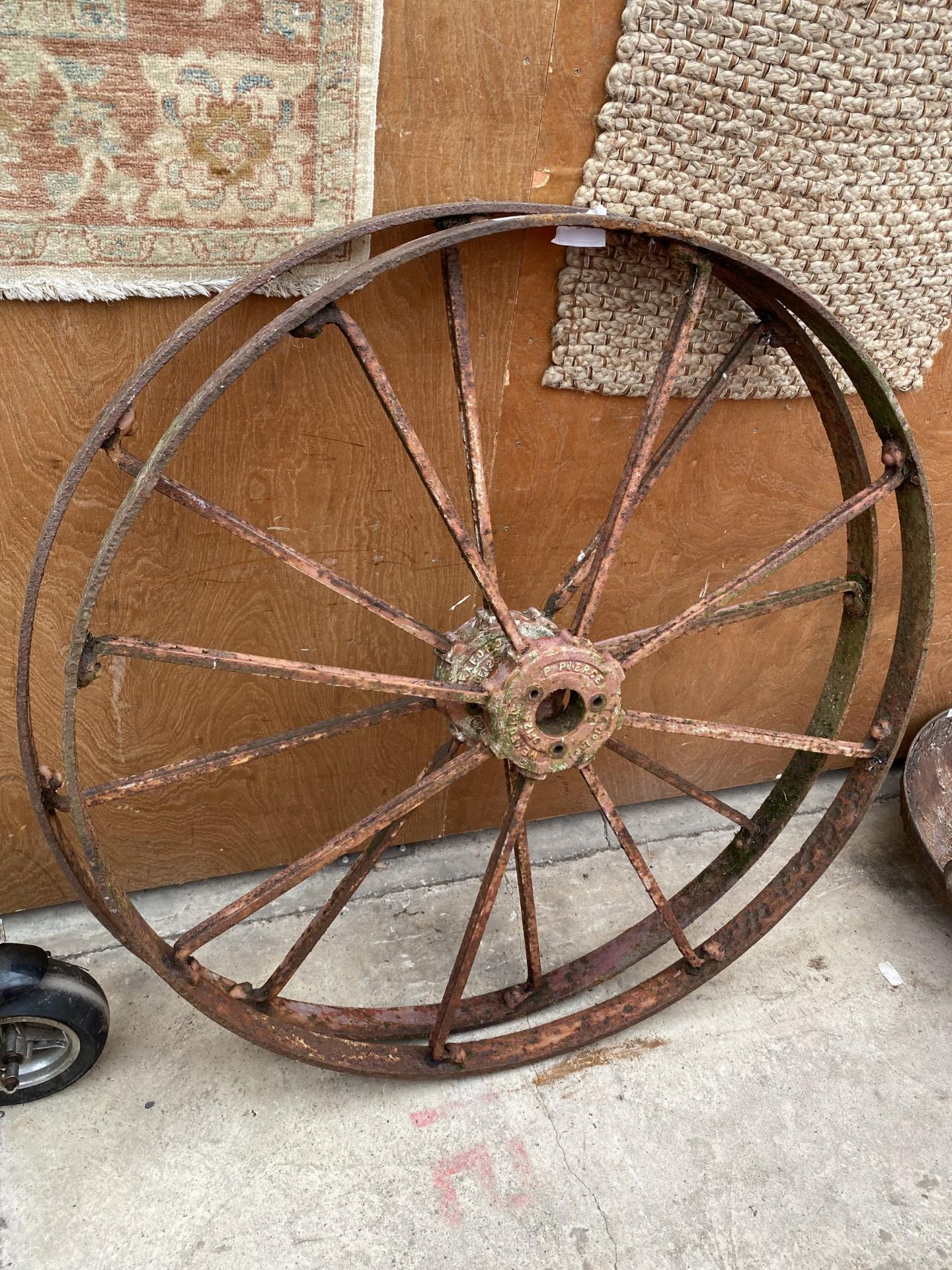 A PAIR OF LARGE CAST IRON 'P. PIERCE AND CO WEXFORD' IMPLEMENET WHEELS