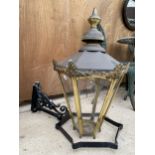 A DECORATIVE BRASS LIGHT FITTING AND CAST ALLOY BRACKET