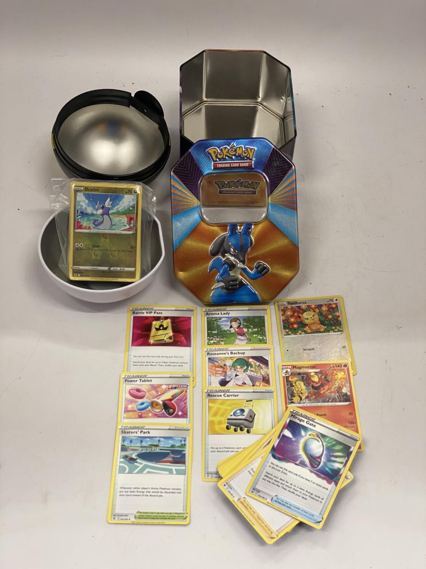 TWO POKEMON COLLECTORS TINS WITH 110+ POKEMON CARDS INCLUDING HOLOS