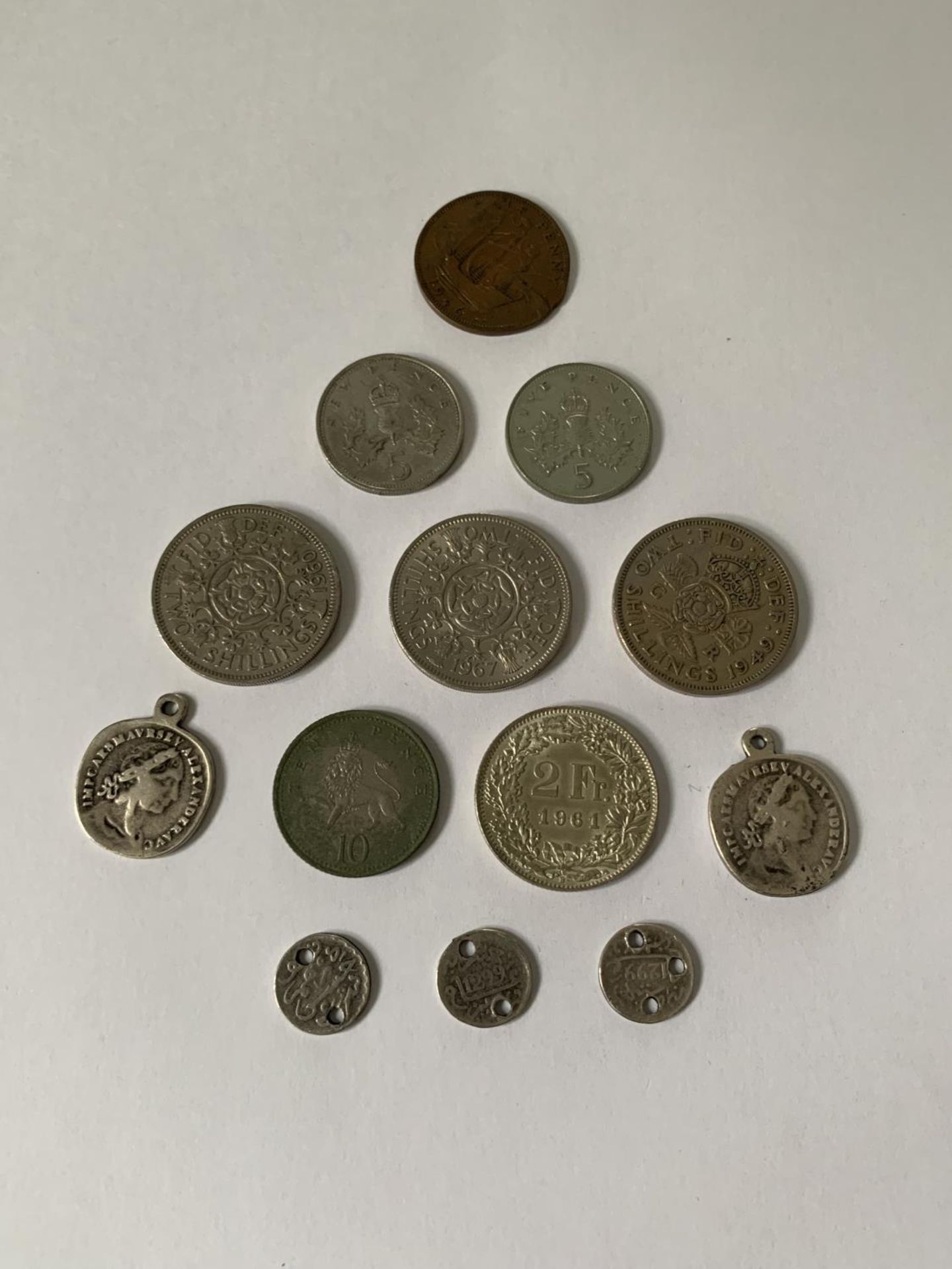 VARIOUS COINS TO INCLUDE FIVE PENCE, TWO SHILLINGS, TWO FRANC ETC