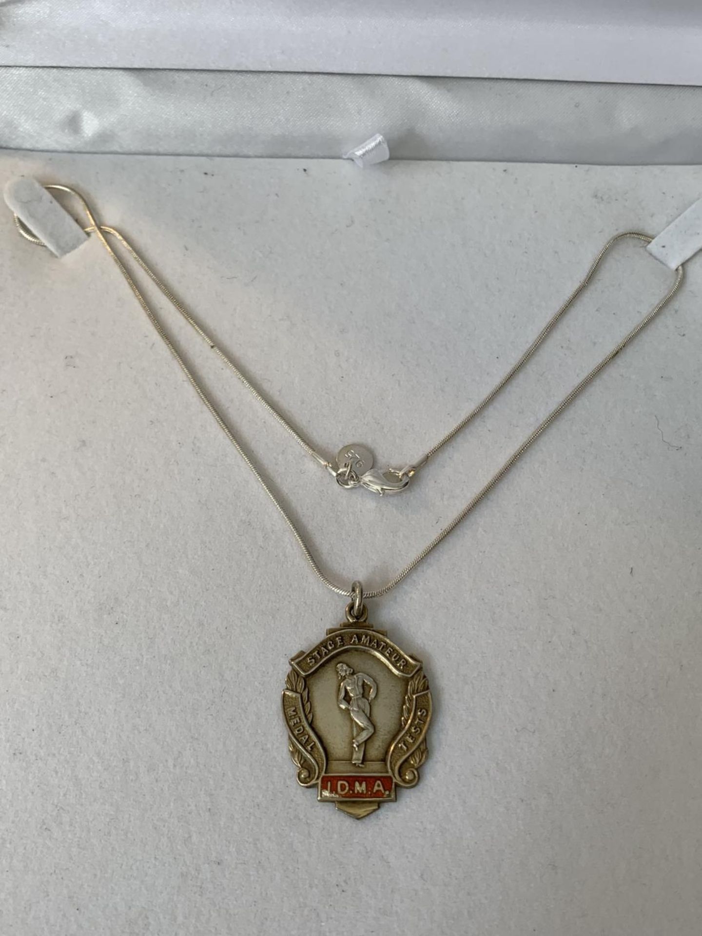 A SILVER NECKLACE WITH A HALLMARKED BIRMINGHAM SILVER DANCE MEDAL IN A PRESENTATION BOX
