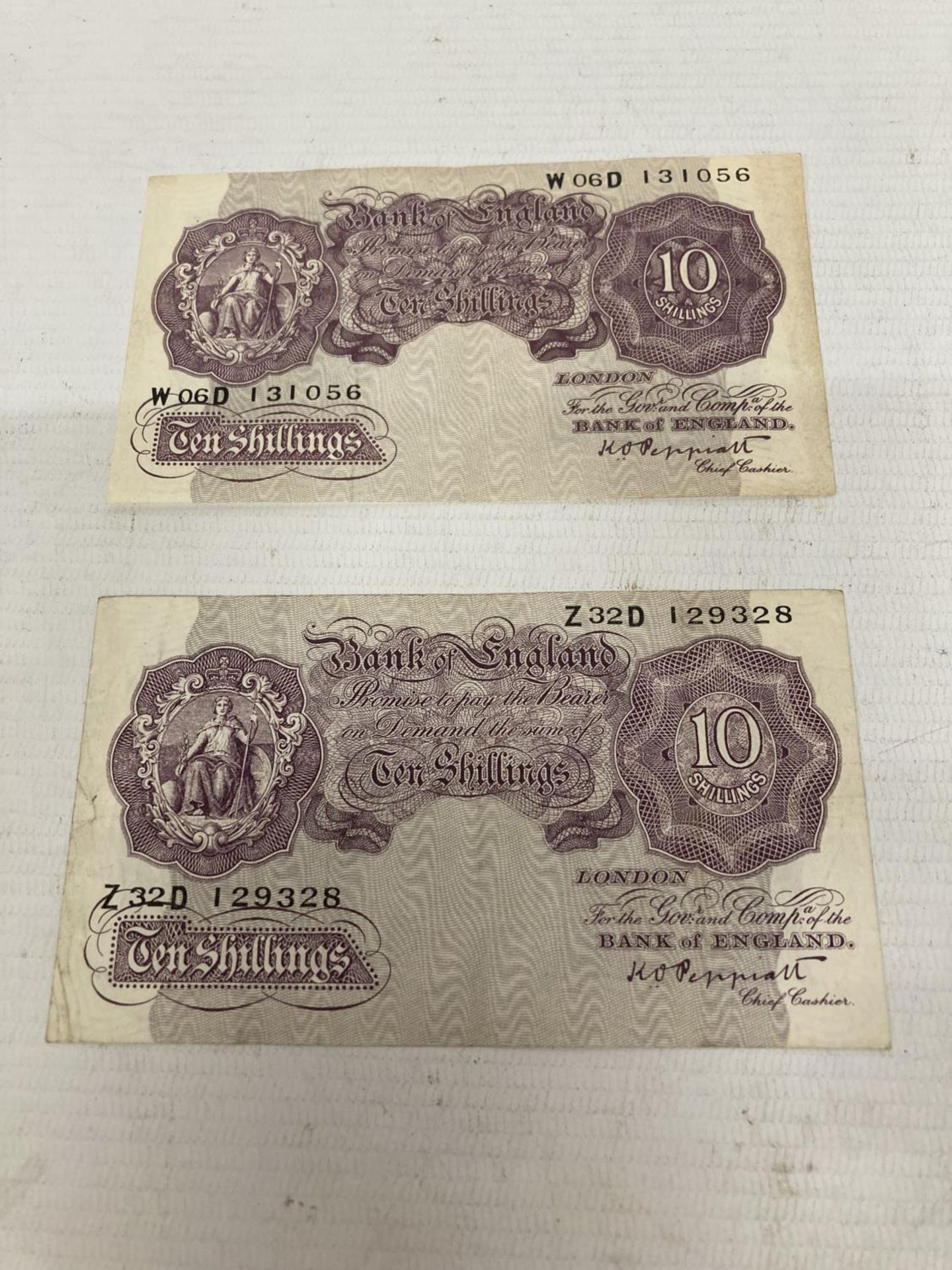 TWO BANK OF ENGLAND MAUVE TEN SHILLINGS NOTES SIGNED PEPPIATT (1934-1949)