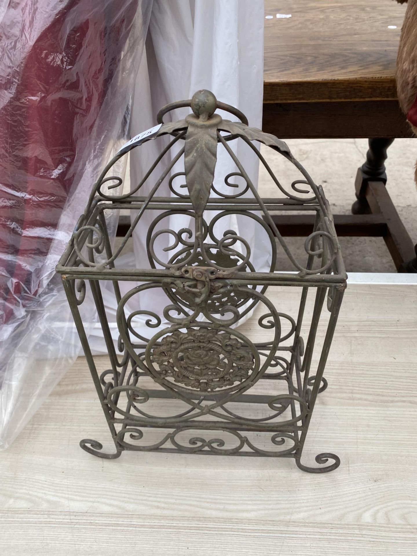 A DECORATIVE METAL TWO WINE BOTTLE HOLDER