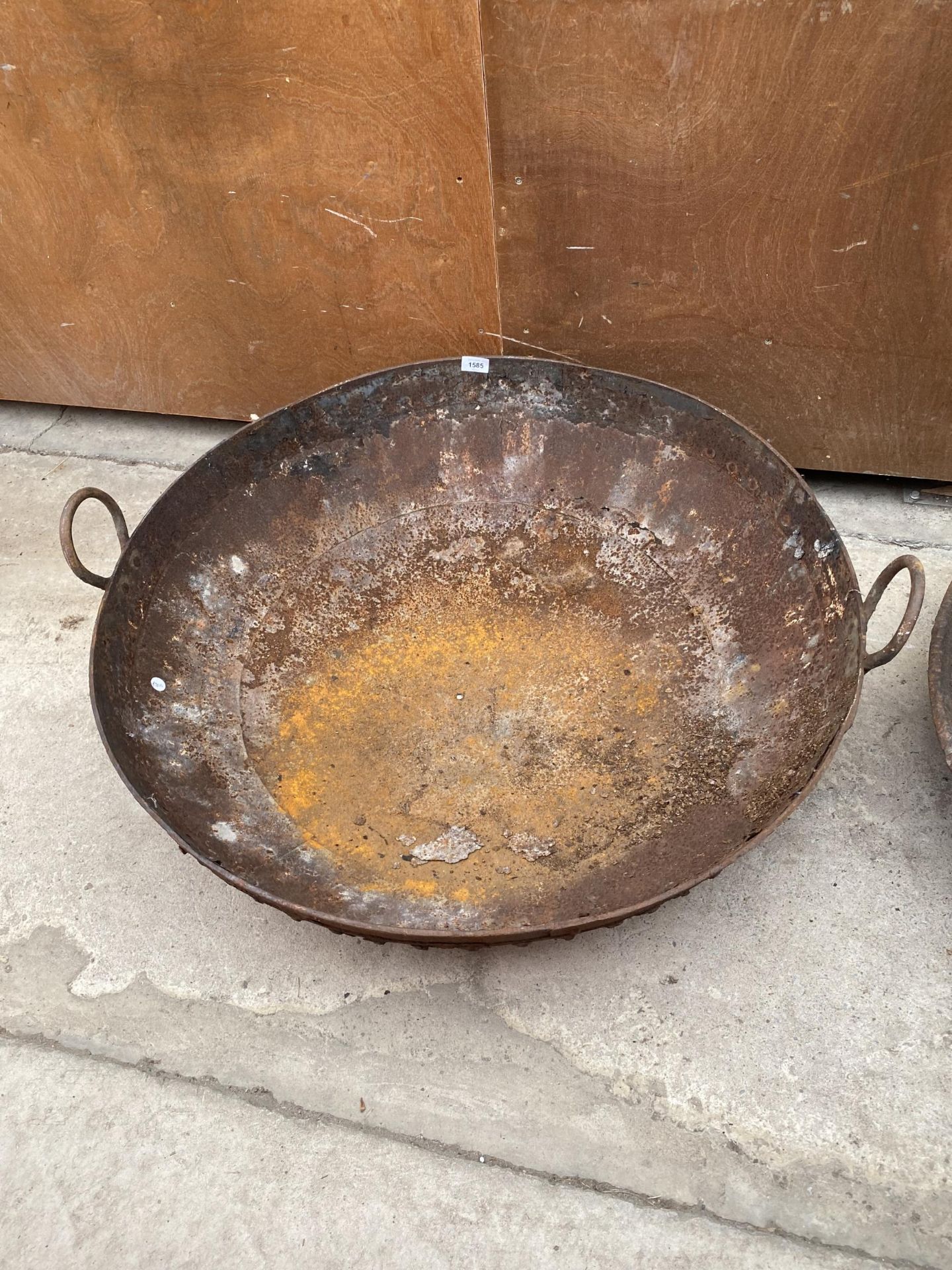 A LARGE STEEL FIRE PIT BOWL