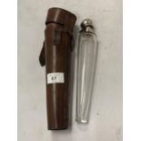 A VINTAGE LEATHER CASE WITH HUNTING GLASS VIAL WITH WHITE METAL TOP