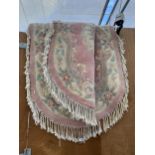 TWO PINK PATTERNED OVAL FRINGED RUGS