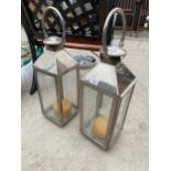 A PAIR OF LARGE DECORATIVE CANDLE LANTERNS
