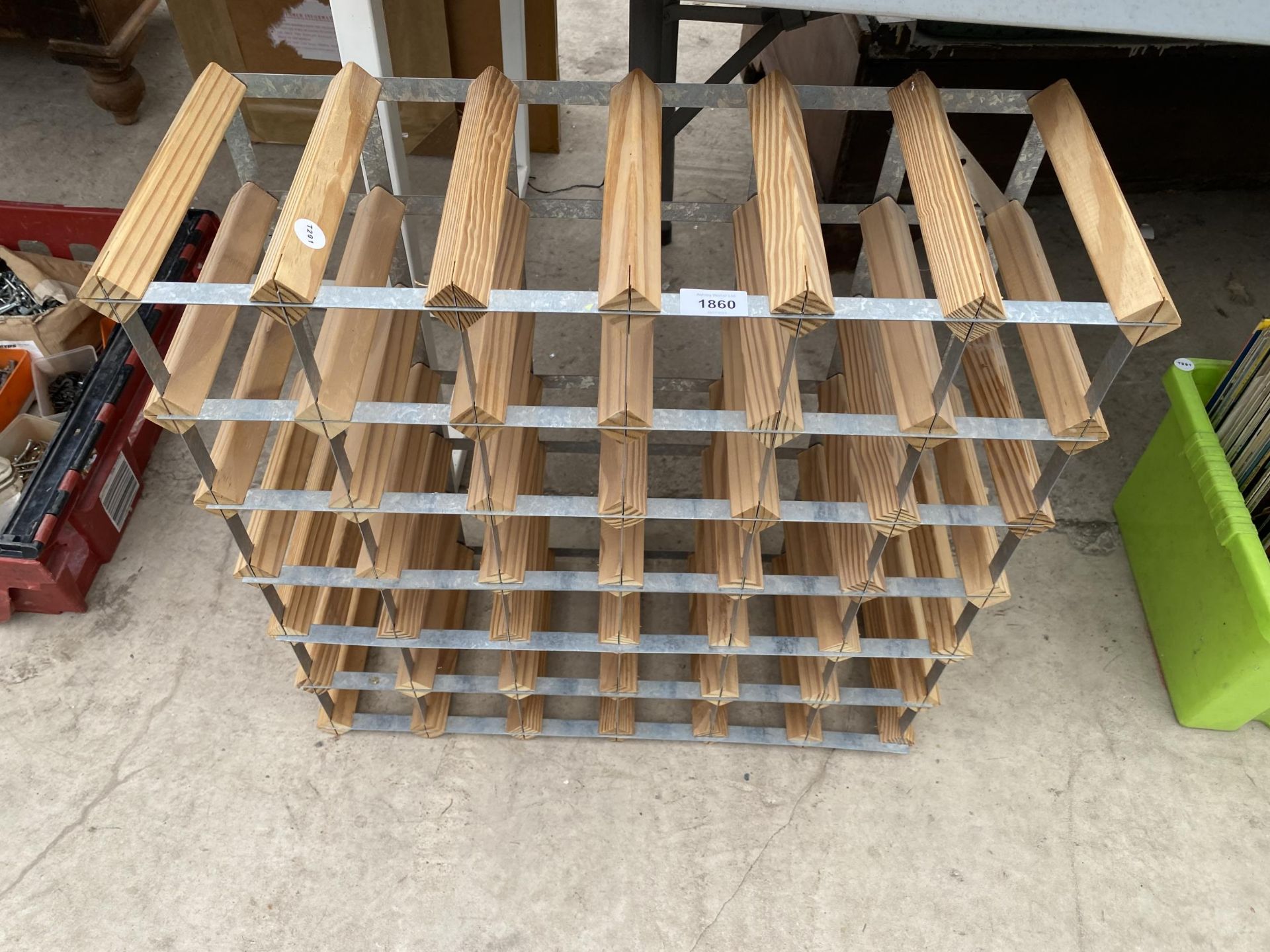 A WOODEN AND METAL 36 BOTTLE WINE RACK