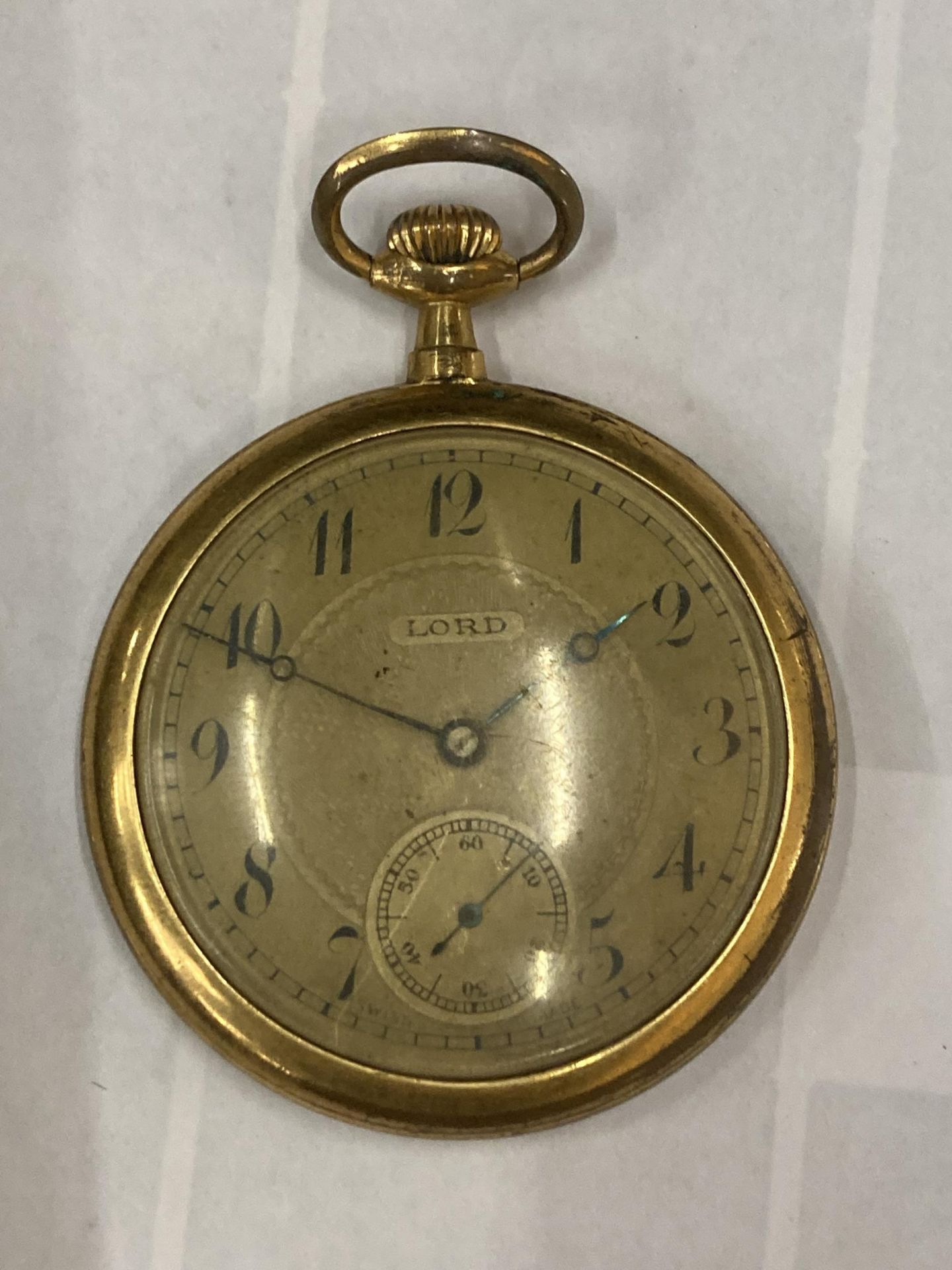 A VINTAGE LORD OPEN FACED POCKET WATCH