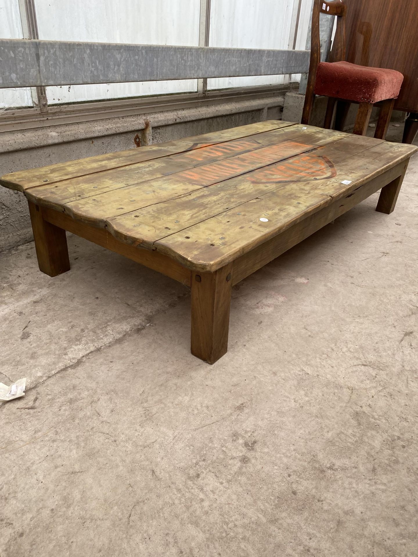 A RUSTIC LOW COFFEE TABLE, THE TOP BEARING HARLEY-DAVIDSON MOTORCYCLES LOGO, 56X27" - Image 2 of 3