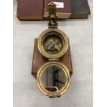 A BRASS COMPASS IN WOODEN BOX