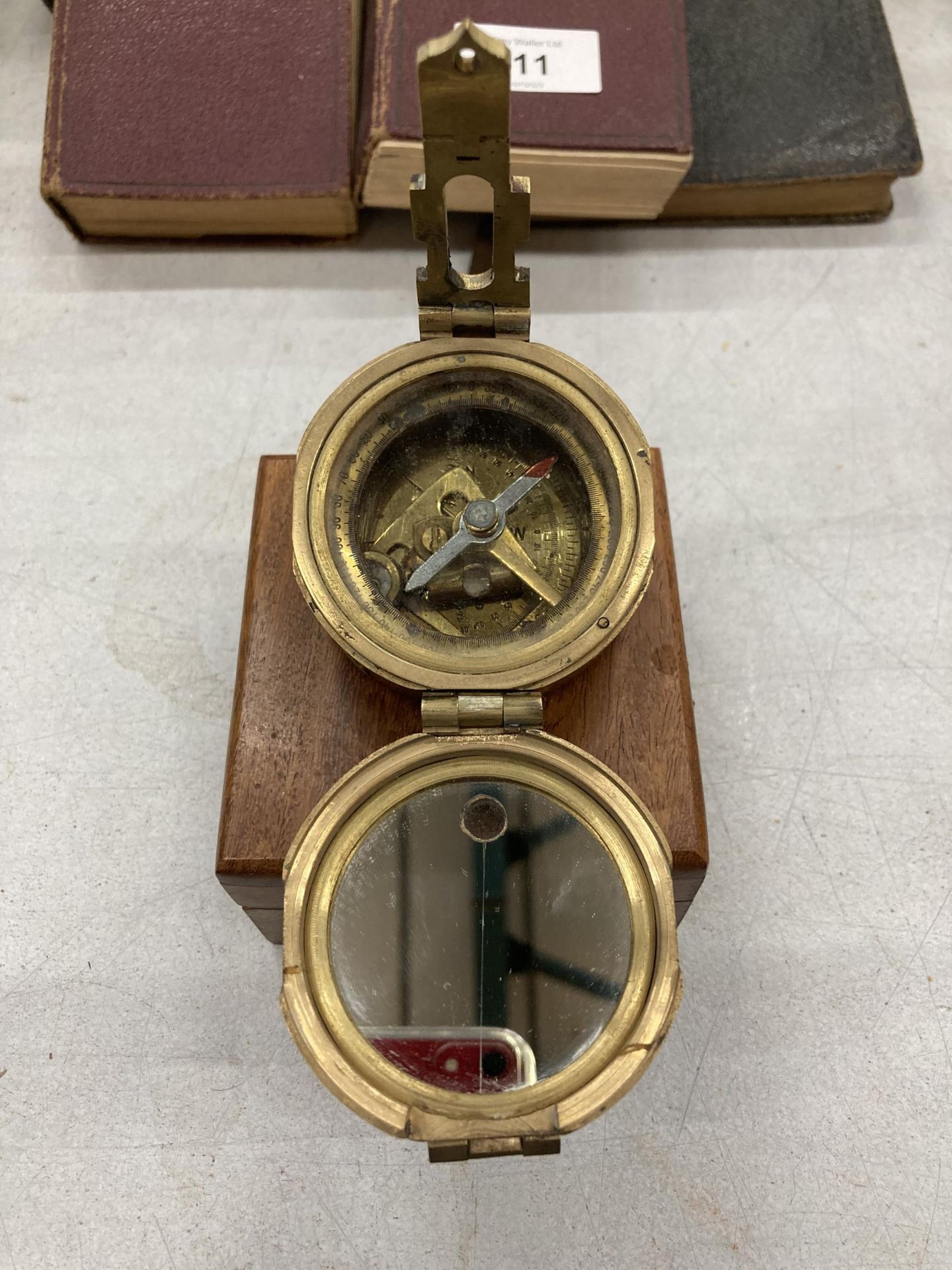 A BRASS COMPASS IN WOODEN BOX