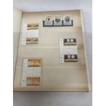 HONG KONG , RED STOCK BOOK HOUSING UNMOUNTED MINT RANGES OF COMMEMORATIVES AND DEFINITIVES ,
