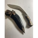 A KUKRI KNIFE WITH INDIAN STYLE HANDLE AND LEATHER SHEATH