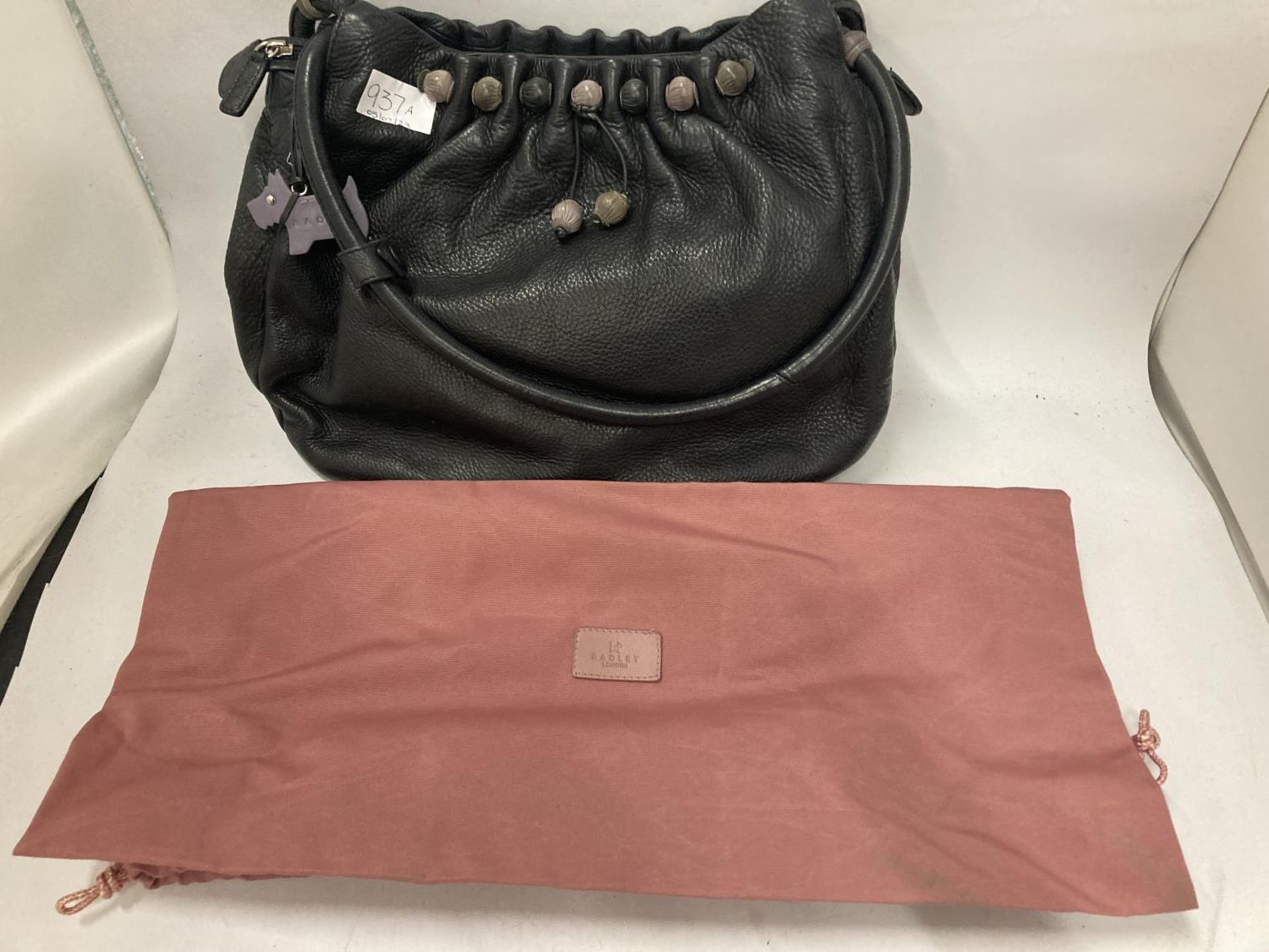 A BLACK RADLEY HANDBAG WITH DUST JACKET