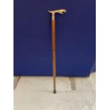 A WALKING STICK WITH CHROME JAGUAR HANDLE