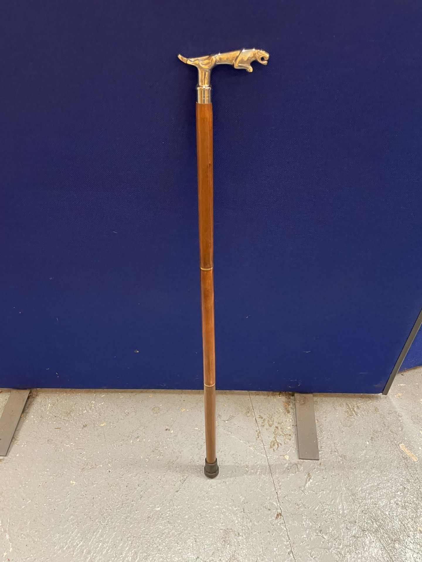 A WALKING STICK WITH CHROME JAGUAR HANDLE