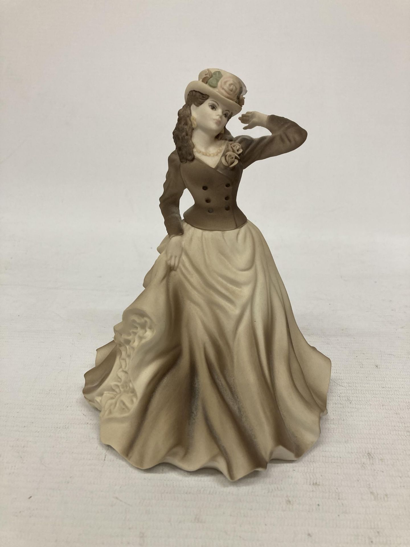 A COALPORT BEAU MONDE FIGURINE "MEG" WITH A MATT FINISH