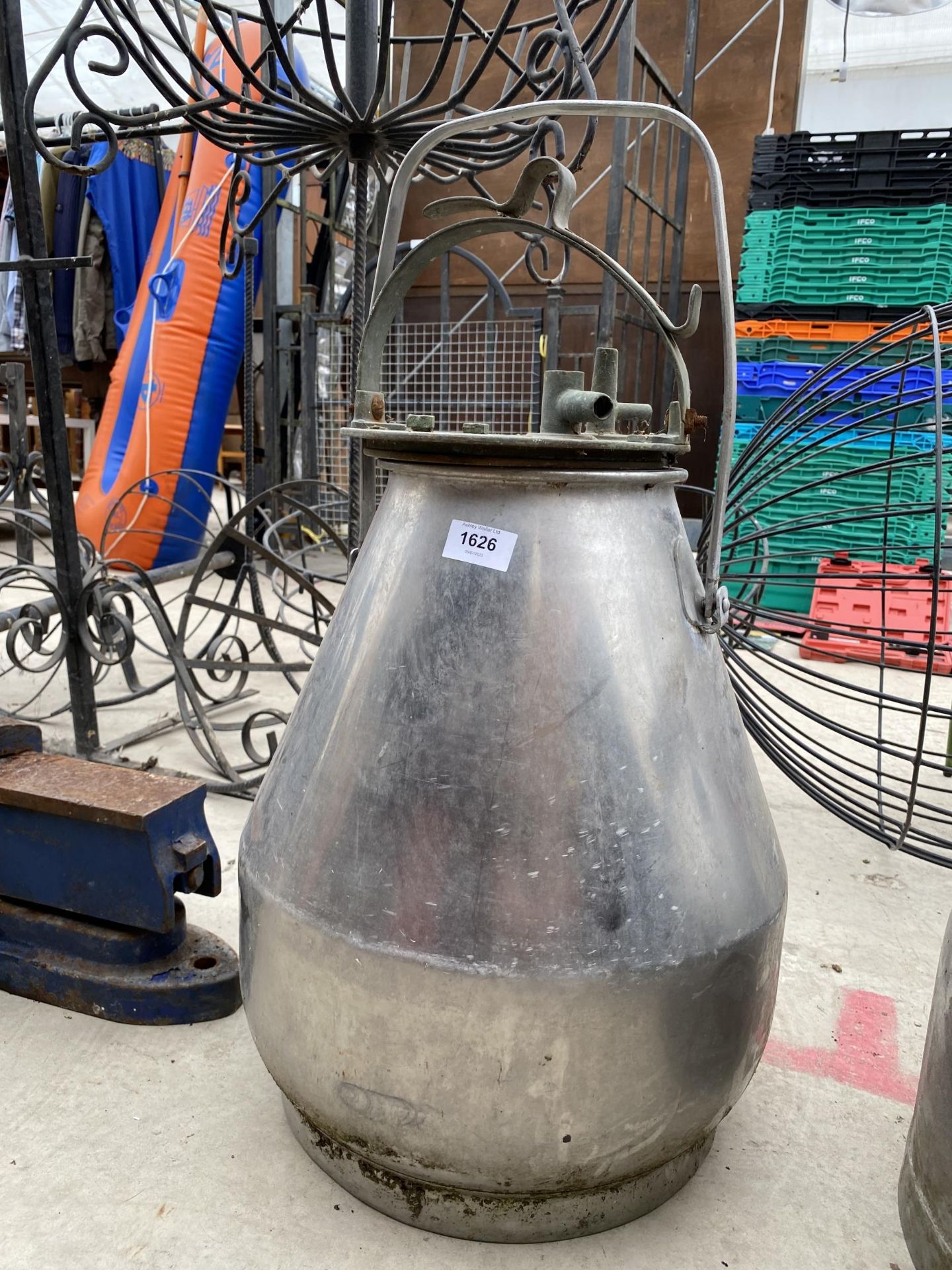 A STAINLESS STEEL MILKING BUCKET/PLANTER WITH LID