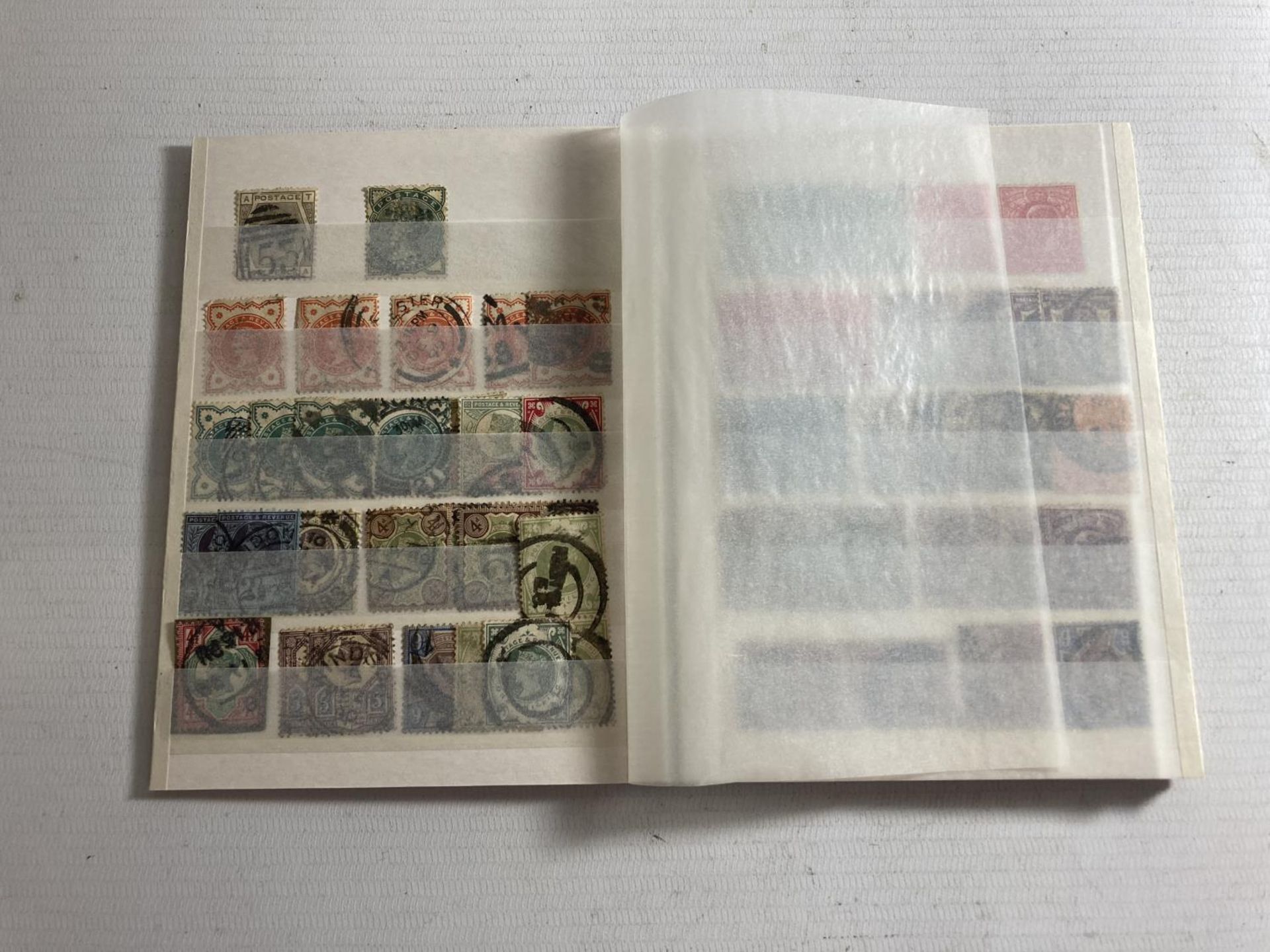 SMALL RED STOCK BOOK CONTAINING GB , QV-GV . TWO 1840 2D BLUES ARE PRESENT PLUS QV TO 1/- AND EV11