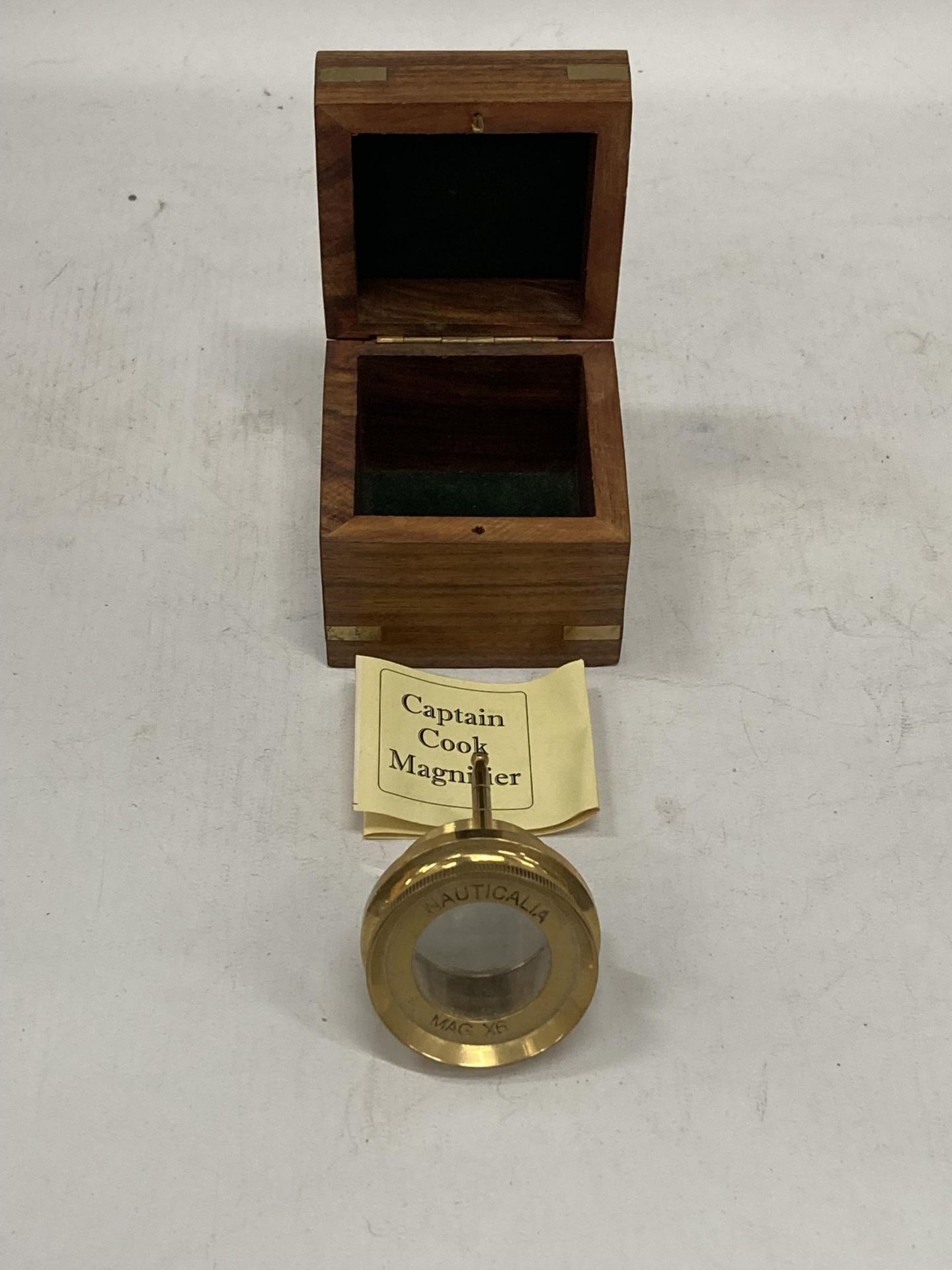 A 'CAPTAIN COOK' BRASS MAGNIFYING GLASS IN A WOODEN BOX