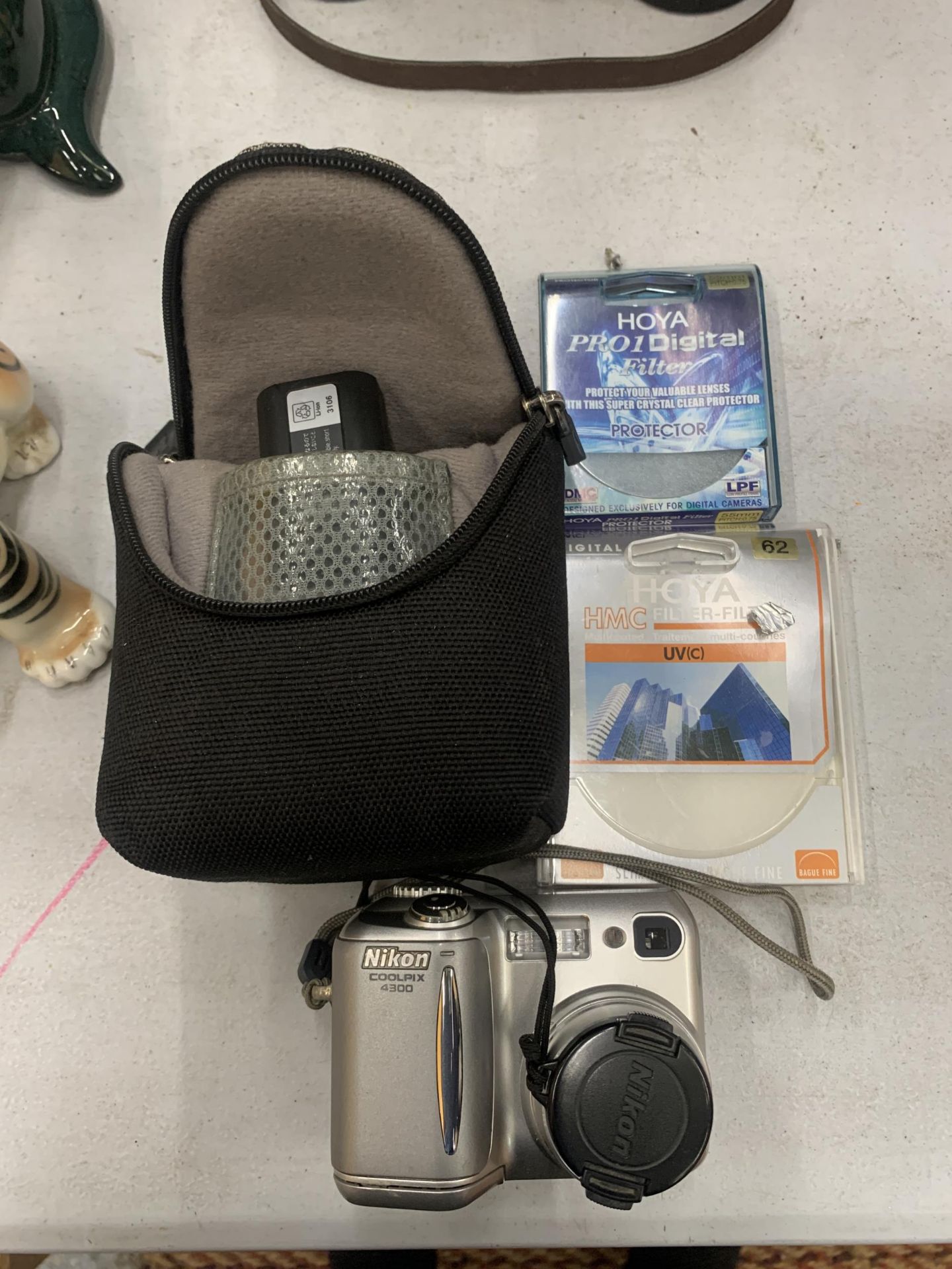 A NIKON COOLPIX 4300 CAMERA WITH CASE AND ACCESSORIES