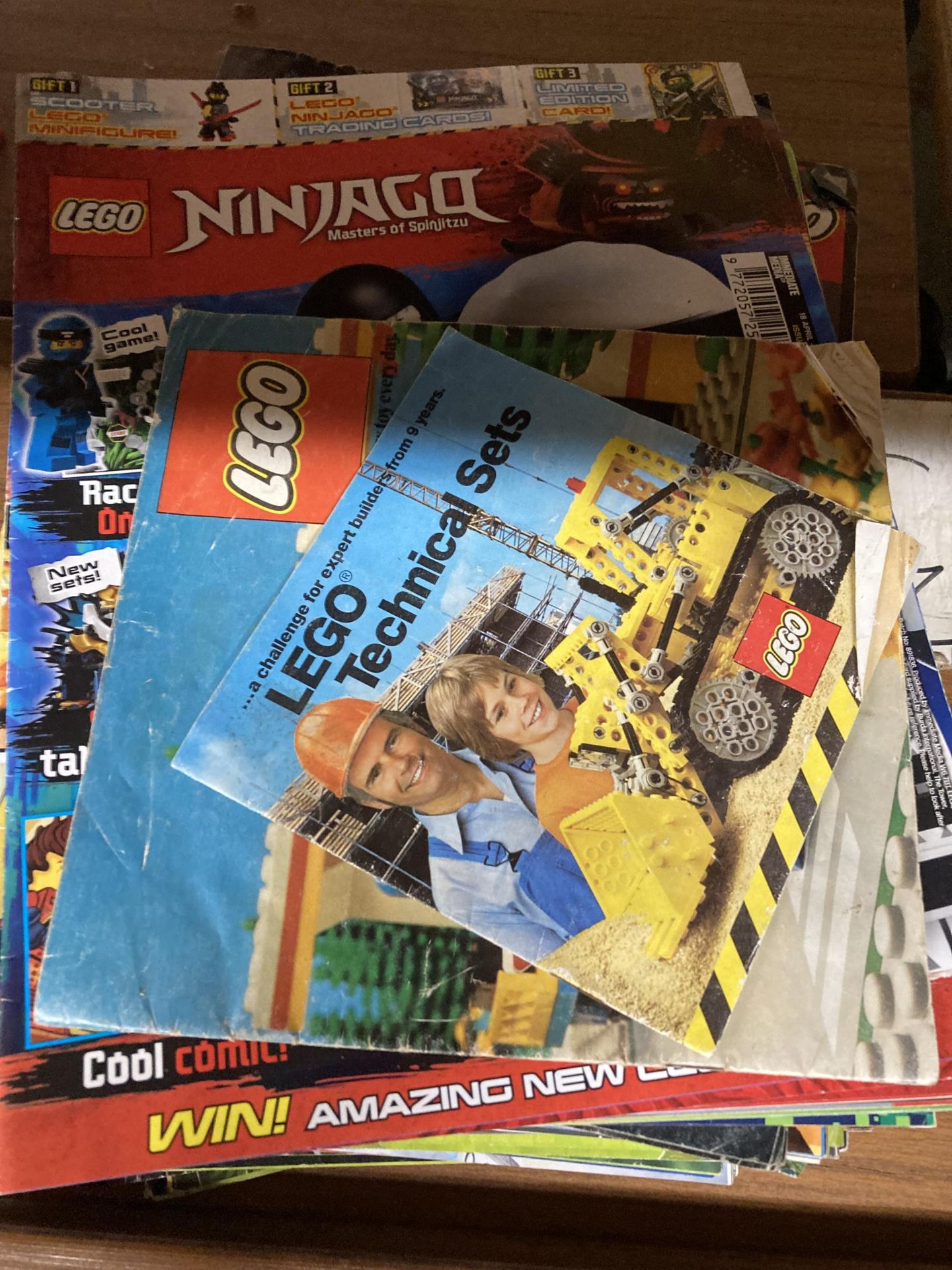 A GROUP OF LEGO BOOKLETS AND MAGAZINES