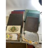 A COLLECTION OF VINTAGE STAMP ALBUMS CONTAINING WORLD STAMPS - 6 IN TOTAL, PLUS A QUANTITY OF