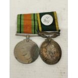 TWO MEDALS ON RIBBONS TO INCLUDE A DEFENCE MEDAL AND ONE FOR EFFICIENT SERVICE