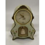 A VINTAGE MANTLE CLOCK WITH AN INSET DANCING BALLERINA