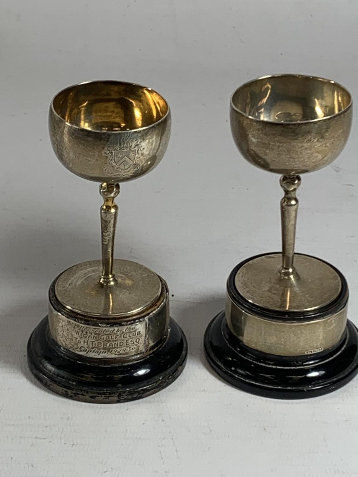 TWO HALLMARKED SILVER TROPHIES ON WOODEN BASES GROSS WEIGHT 160 GRAMS (81 GRAMS WITHOUT THE BASES)