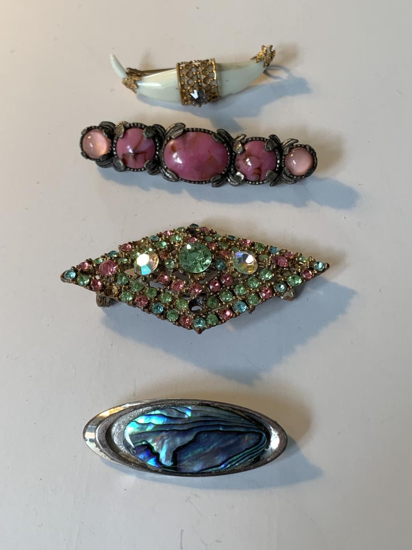 FOUR VARIOUS BROOCHES