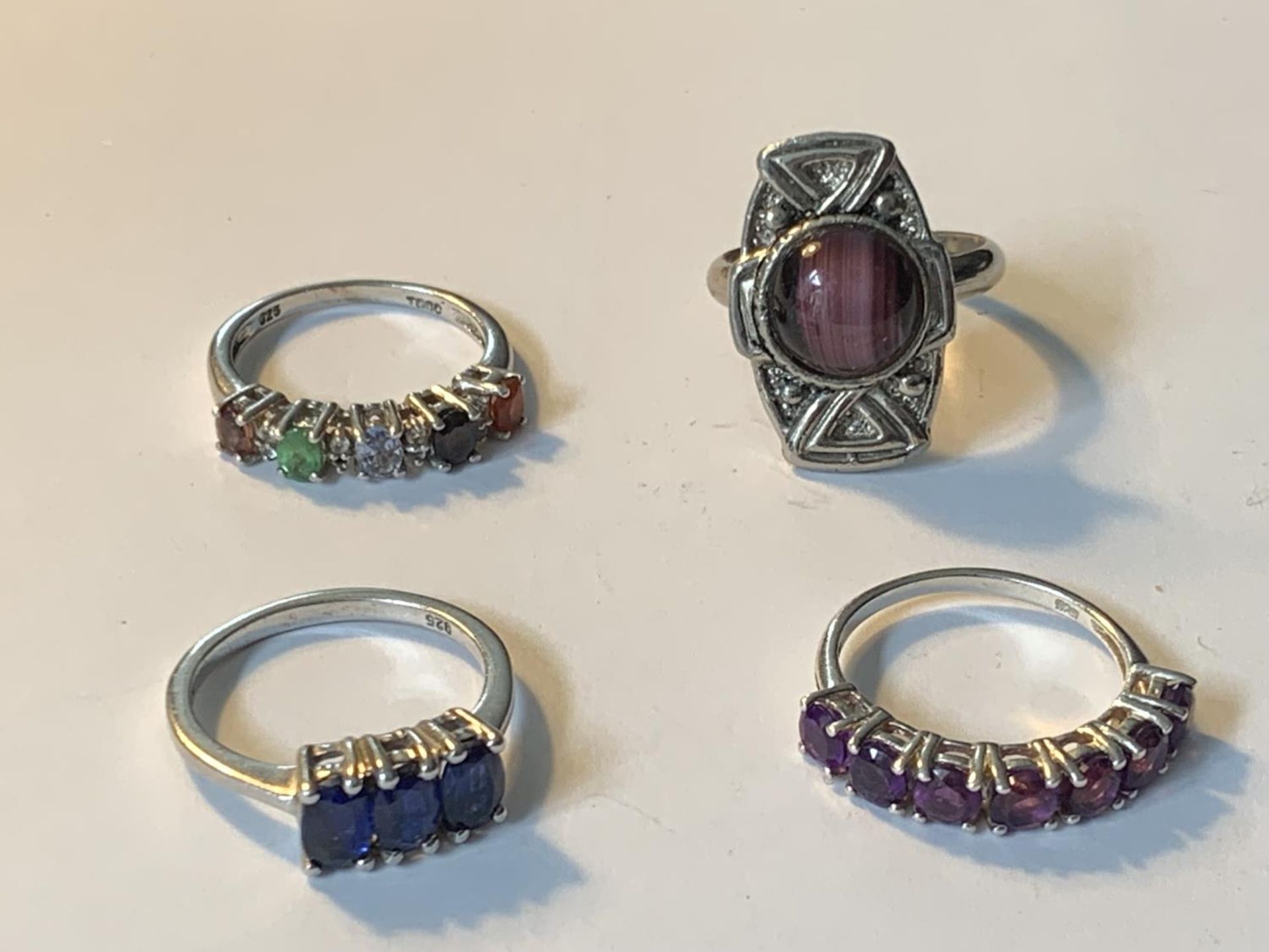 FOUR VARIOUS SILVER RINGS