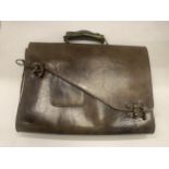 A VINTAGE LEATHER BRIEFCASE