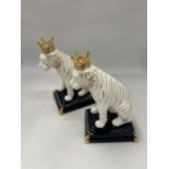 A PAIR OF GILT POTTERY LION FIGURES