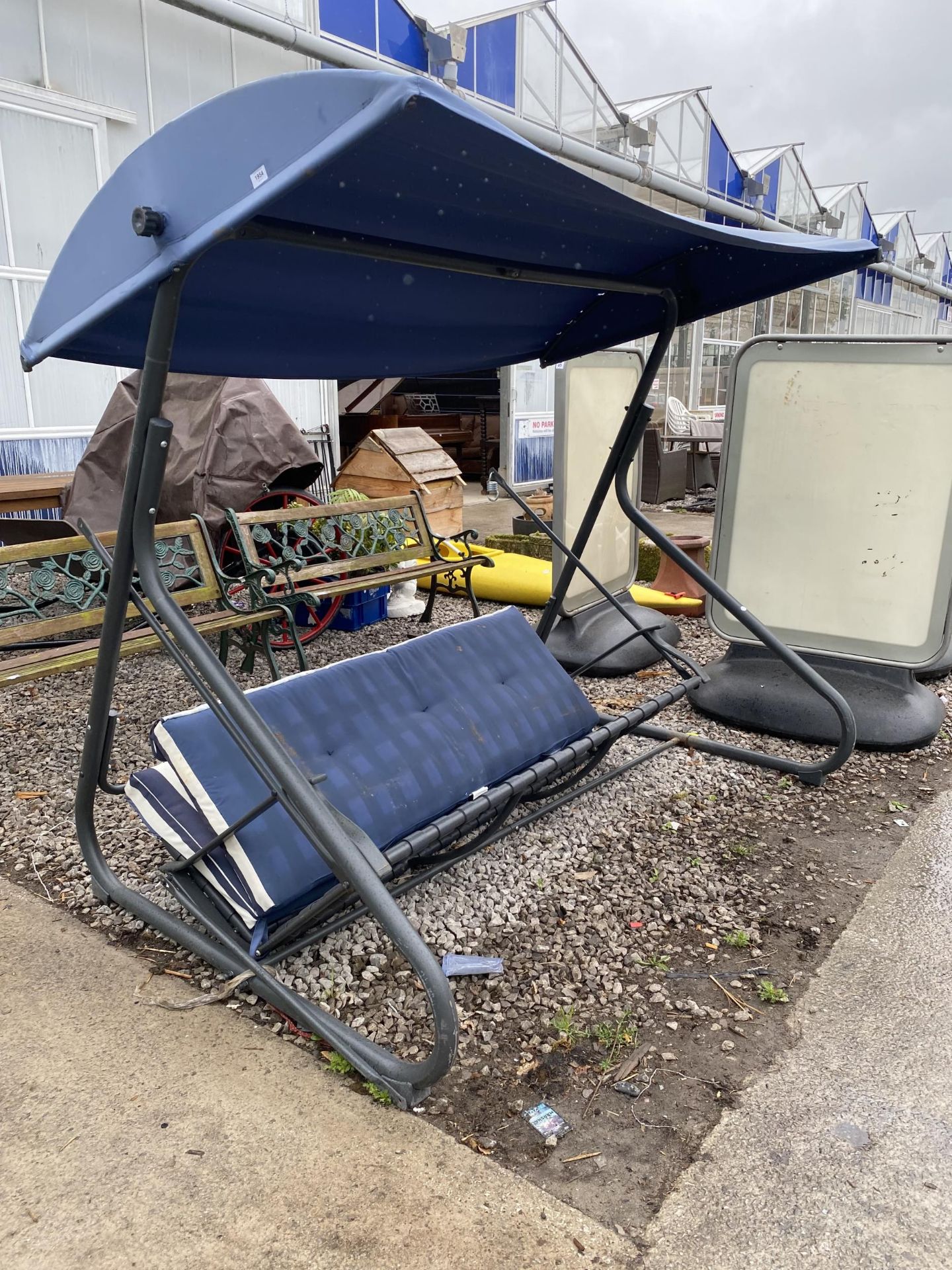 A METAL FRAMED GARDEN SWING SEAT (A/F)