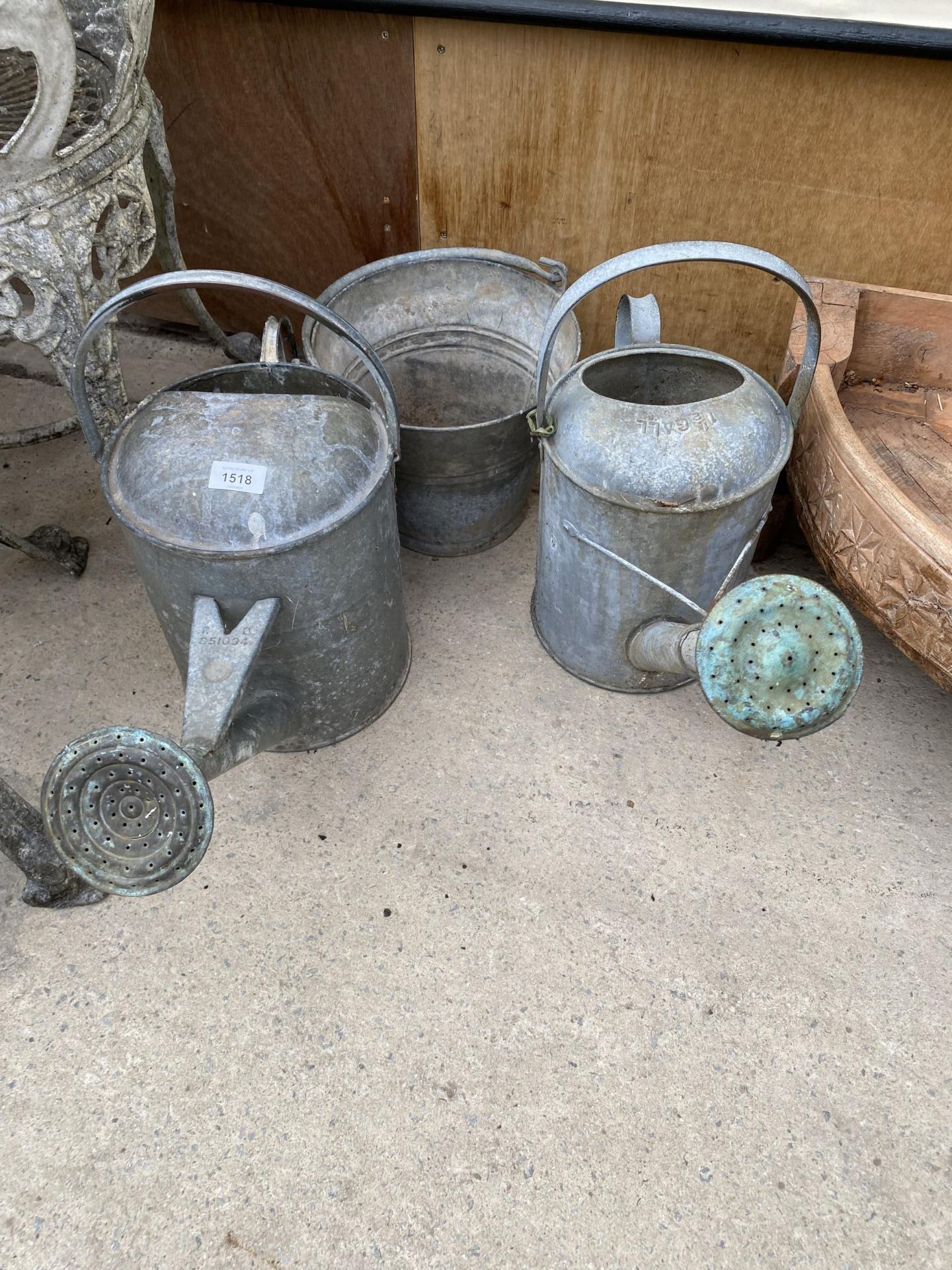 TWO VINTAGE GALVANISED WATERING CANS AND A GALVANISED BUCKET