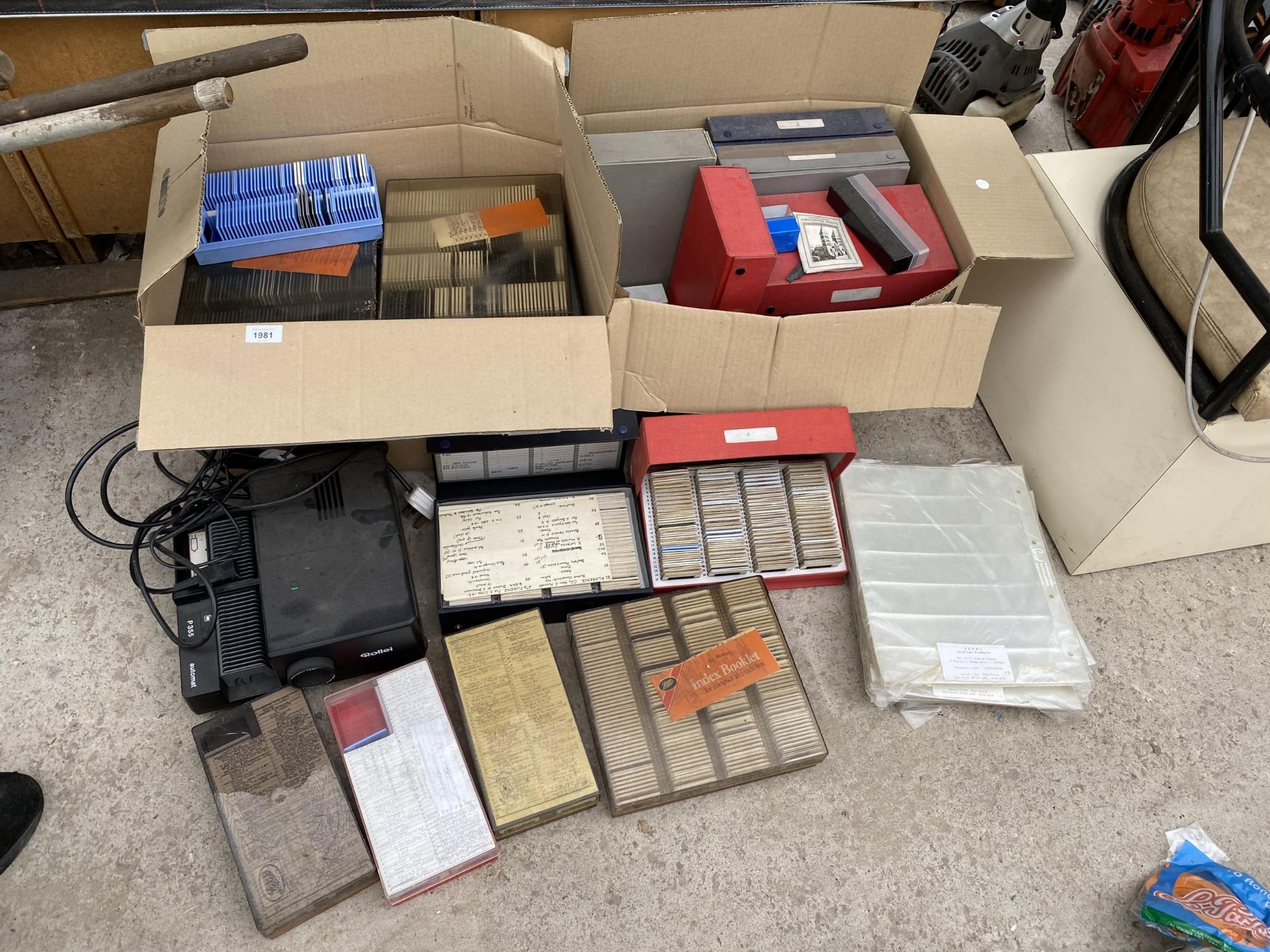 A ROLLEI PROJECTOR AND AN ASSORTMENT OF SLIDES