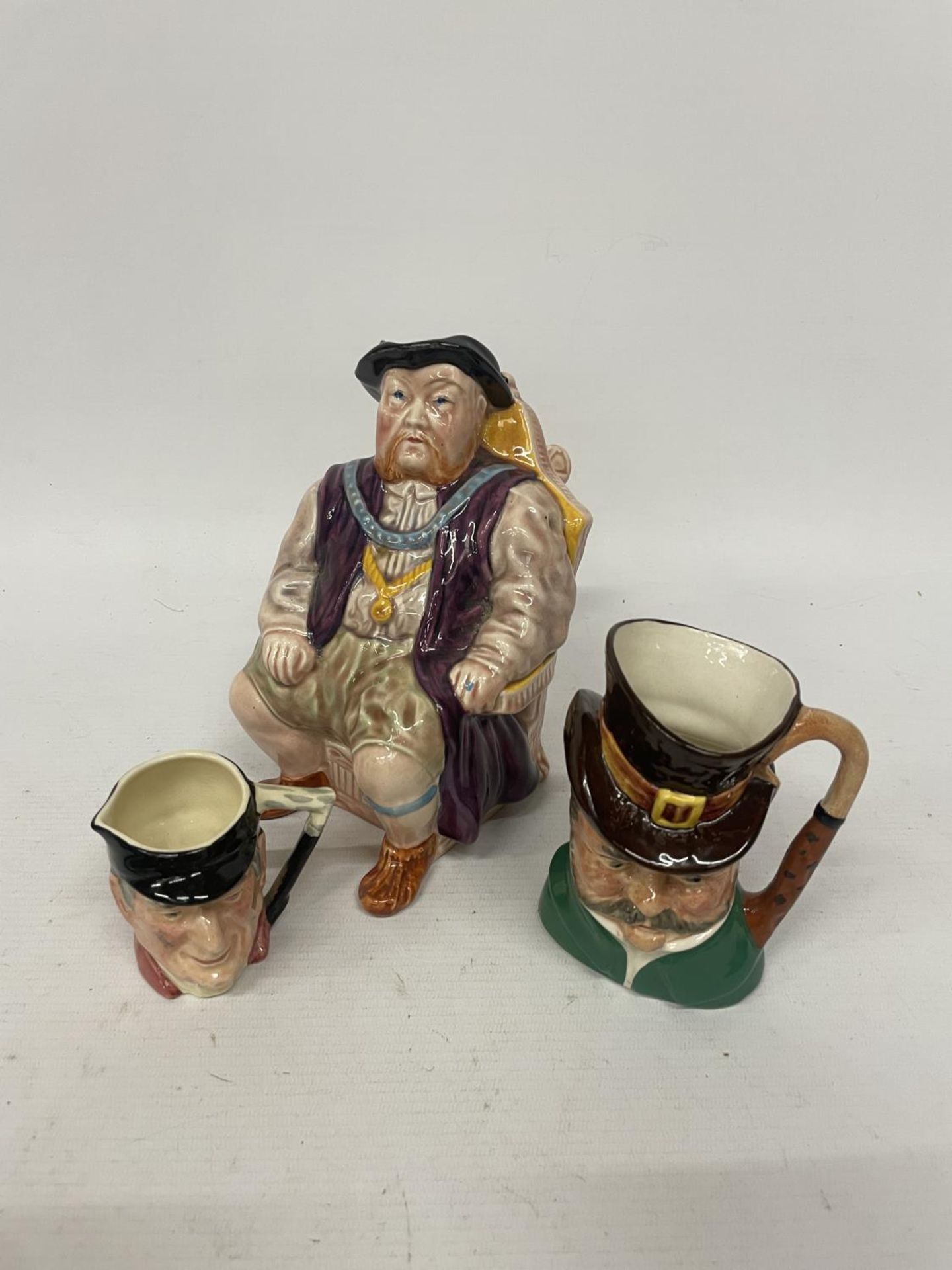 THREE VARIOUS SIZED TOBY JUGS